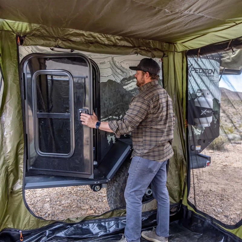 23zero Vehicle Awning Bushman Room Set up with Adult Standing Inside