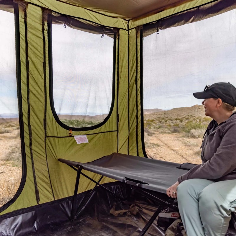 23zero Vehicle Awning Bushman Room Person Sitting On Cot Inside