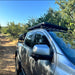 Eezi awn ford ranger roof rack on truck driving down dirt road front left view