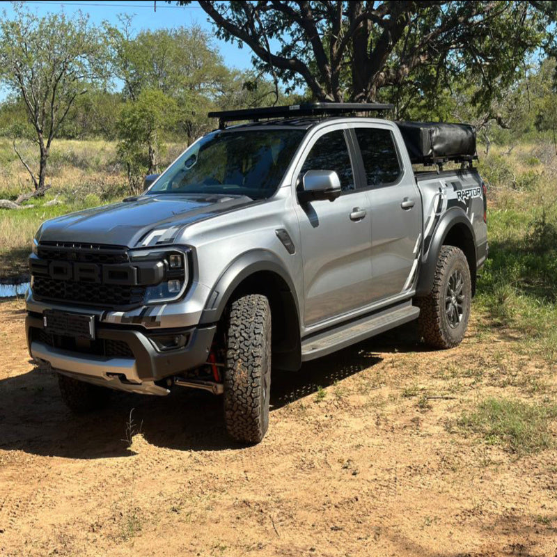Eezi awn ford ranger roof rack kit on truck front parked in desert right view