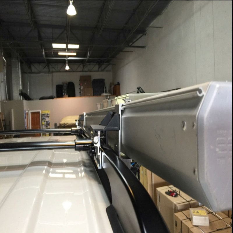 Eezi awning brackets for roof rails series 2000 with mount on suv bar rear left view in warehouse