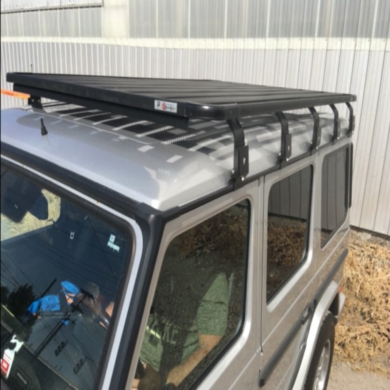 Eezi awn k9 mercedes g class roof rack top right view outside next to warehouse