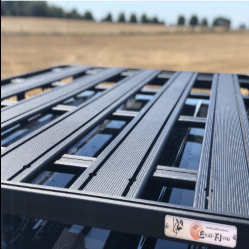 Eezi awn land rover defender roof rack  on black suv jeep outside top view closeup