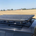 Eezi awn land rover defender roof rack on black suv outside top right view