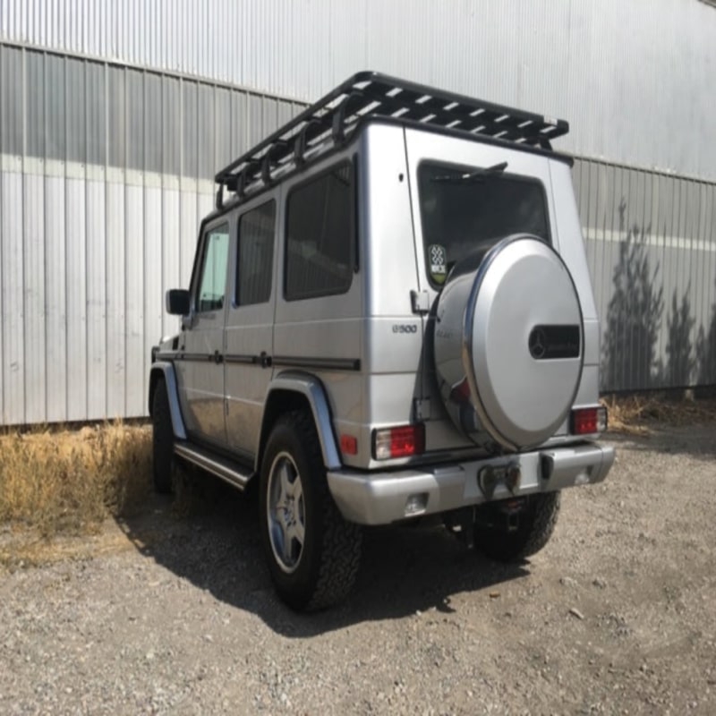 Eezi awn mercedes roof racks on g wagon left rear view next to warehouse