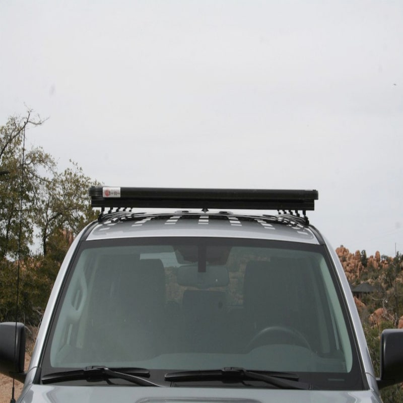 Eezi awn roof rack k9 front view in black on jeep outside