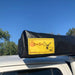 Eezi dragonfly 180 automobile awning closeup of yellow logo on truck outside
