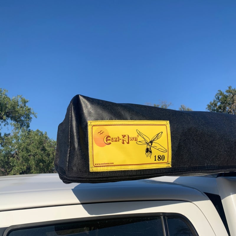 Eezi dragonfly 180 automobile awning closeup of yellow logo on truck outside