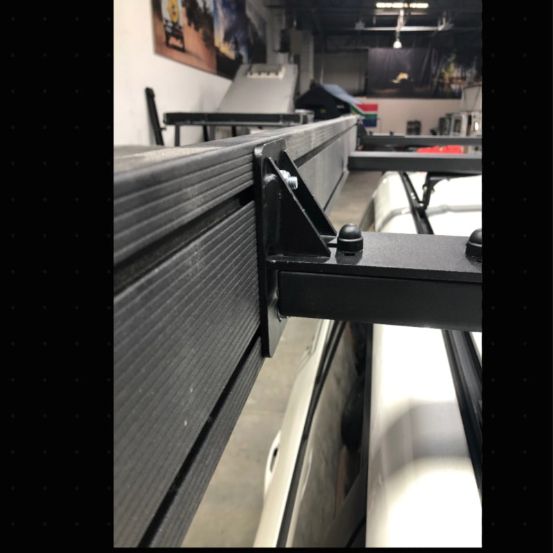 Eezi k9 load bar mount outdoor bracket in black metal mounted on rack with awning secured in garage