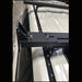 Eezi k9 load bar mount overlanding bracket in black metal top down front view on suv in garage