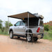 Eez swift awning front left view open set up outside with table and truck