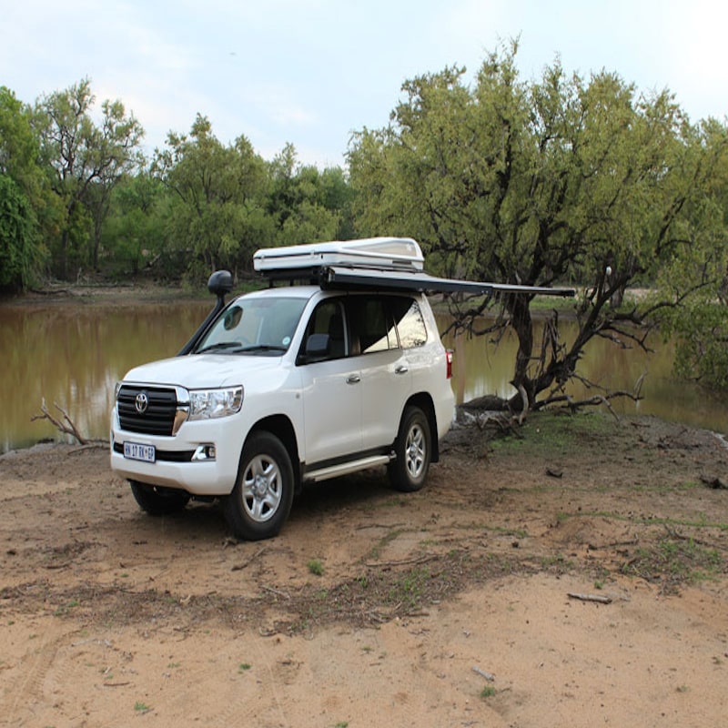 Eez swift awning front right on Toyota suv open by lake