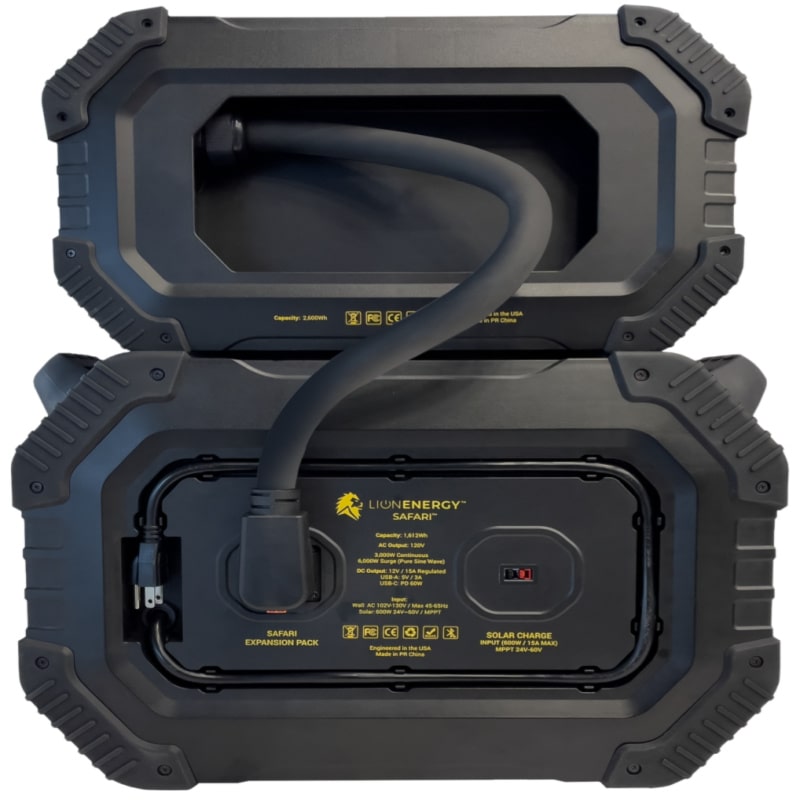 Lion Energy safari xp power station in black plugged into safari charger rear view