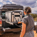 arb cooler in truck on slide out rack outdoors and woman unloading