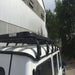 eezi awn mercedes g wagon roof rack on white suv rear right view next to warehouse